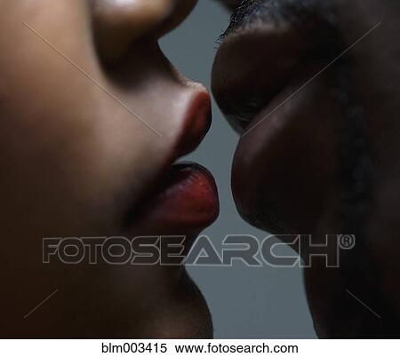 Stock Photography - Close up of couple about to kiss. Fotosearch