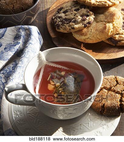 Close up of cup of tea with cookie View Large Photo Image Stock Photo - Close up of cup of tea with cookie. Fotosearch