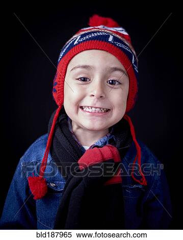 Stock Photography - Close up of Hispanic boy wearing warm clothing. Fotosearch