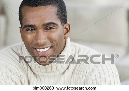 Stock Image - Close up of Indian man smiling. Fotosearch