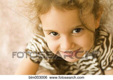 Close up of mixed race girl smiling View Large Photo Image Stock Photograph - Close up of mixed race girl smiling. Fotosearch