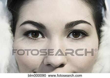 Stock Image - Close up of Mixed Race womanÆs eyes. Fotosearch