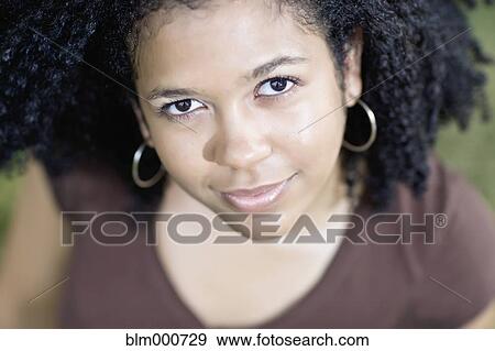 Close up of smiling mixed race woman View Large Photo Image Stock Photo - Close up of smiling mixed race woman. Fotosearch