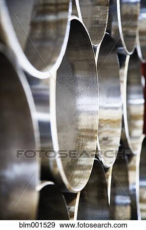 Stock Photo - Close up of stacks of steel pipes. Fotosearch