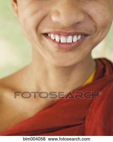 Stock Photo - Close up of teeth of smiling Asian boy. Fotosearch