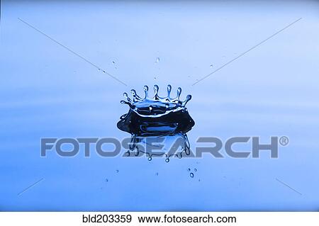 Stock Photo - Close up of water droplet splashing. Fotosearch
