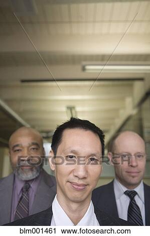 Stock Image - Confident multi-ethnic businessman . Fotosearch