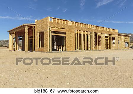 Stock Photo - Construction of house under blue sky. Fotosearch
