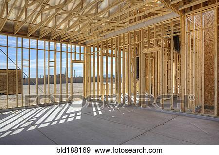 Construction of house under blue sky View Large Photo Image Stock Photo - Construction of house under blue sky. Fotosearch