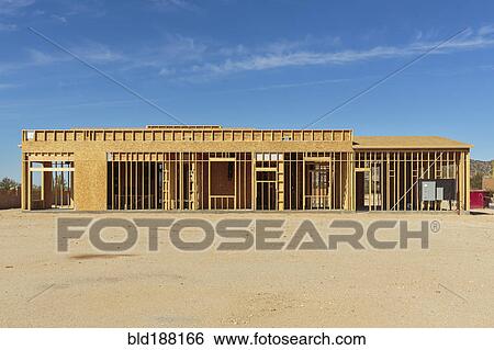 Construction of house under blue sky View Large Photo Image Stock Photograph - Construction of house under blue sky. Fotosearch