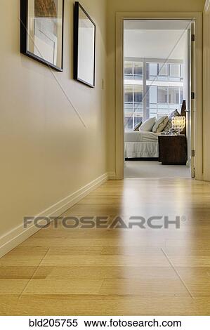 Stock Photography - Corridor leading to bedroom in luxury highrise apartment. Fotosearch