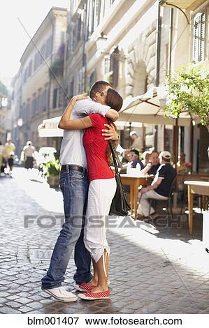 Stock Photo - Couple hugging outdoors. Fotosearch