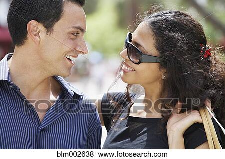 Stock Photo - Couple smiling at each other. Fotosearch