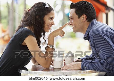 Stock Photography - Couple smiling at each other. Fotosearch
