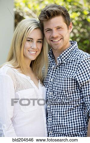 Stock Photograph - Couple smiling outdoors. Fotosearch