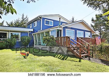 Stock Photograph - Deck and backyard of modern house. Fotosearch