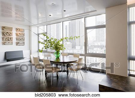 Stock Image - Dining room in luxury highrise apartment. Fotosearch