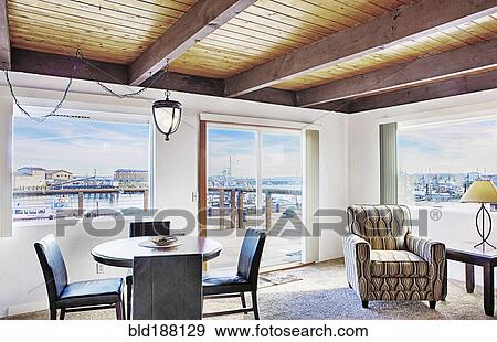 Dining table and armchair in modern living room View Large Photo Image Stock Photo - Dining table and armchair in modern living room. Fotosearch