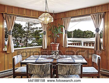 Dining table, chairs and windows in dining room View Large Photo Image Stock Photo - Dining table, chairs and windows in dining room. Fotosearch