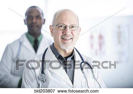 Stock Photo - Doctors smiling in office. Fotosearch
