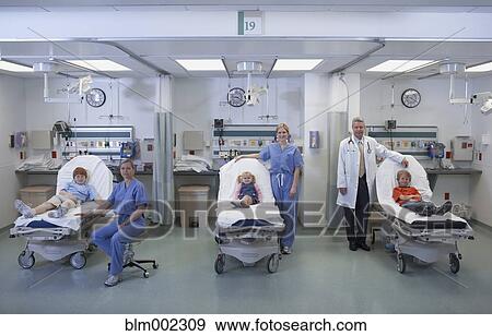 Stock Photo - Doctors with children in hospital beds. Fotosearch
