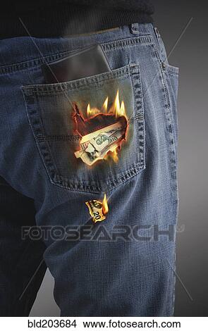 Picture - Dollars burning hole in pocket. Fotosearch