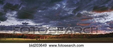 Stock Photo - Dramatic sky over rural landscape. Fotosearch