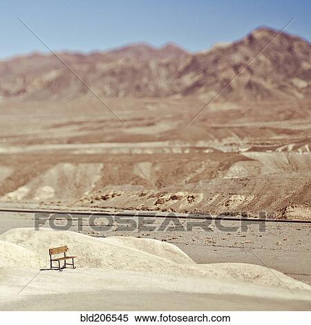 Stock Photography - Empty Bench in Desert Landscape. Fotosearch