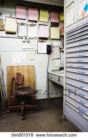 Stock Photo - Empty office area in workshop. Fotosearch