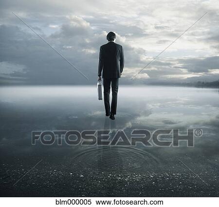 Stock Photography - European businessman walking on water. Fotosearch