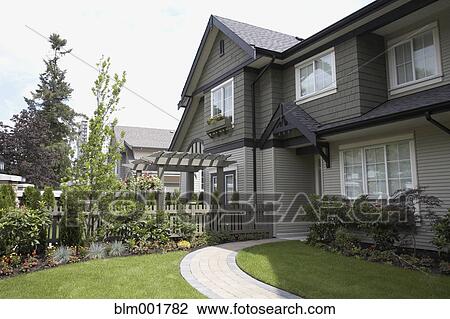 Exterior view of house with stone walkway View Large Photo Image Stock Image - Exterior view of house with stone walkway. Fotosearch