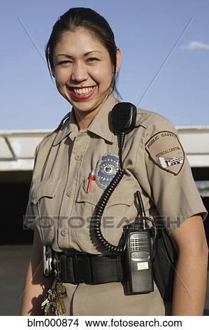 Picture - Female Hispanic security guard. Fotosearch