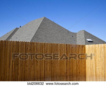Stock Image - Fence and Roof. Fotosearch