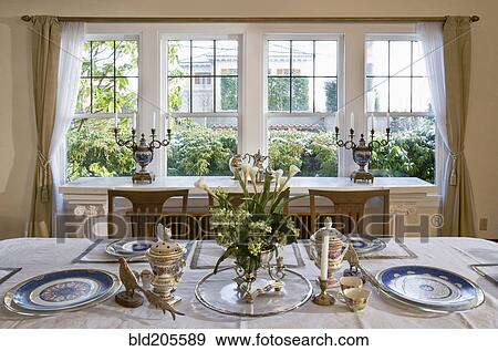 Stock Photo - Fine china on table in luxury dining room. Fotosearch