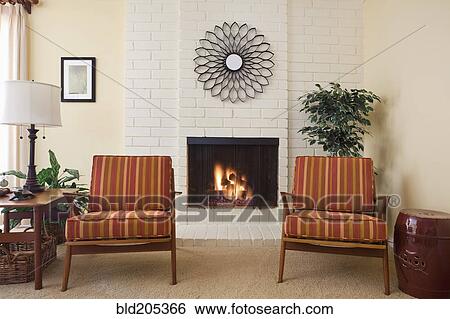 Fireplace and armchairs in living room View Large Photo Image Stock Photograph - Fireplace and armchairs in living room. Fotosearch