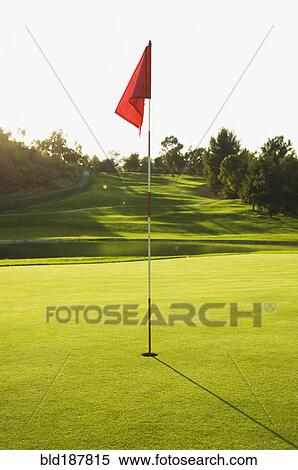Stock Photography - Flag in hole on golf course. Fotosearch