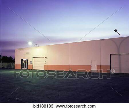 Floodlights over industrial garage doors View Large Photo Image Stock Image - Floodlights over industrial garage doors. Fotosearch