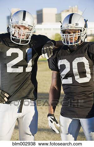 Stock Photo - Football players standing together. Fotosearch