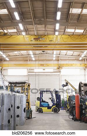Forklift in warehouse View Large Photo Image Stock Photograph - Forklift in warehouse. Fotosearch