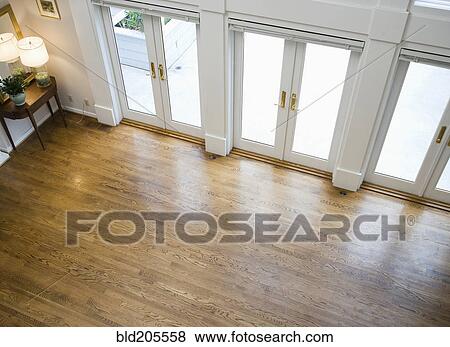 Stock Photo - French doors lining empty room. Fotosearch