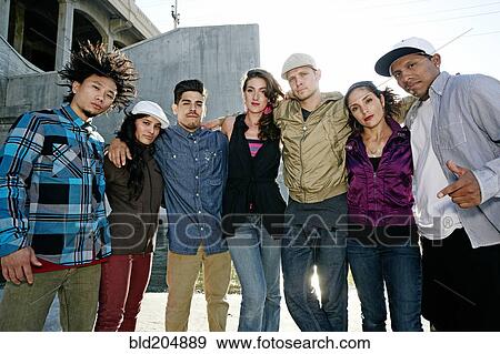 Stock Photo - Friends posing under overpass. Fotosearch