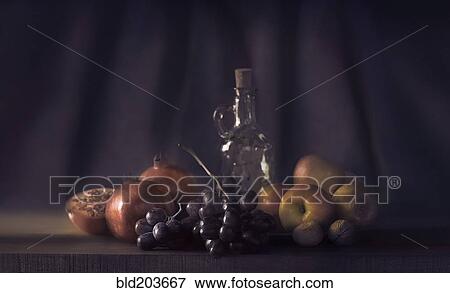Fruit and bottle on table View Large Photo Image Stock Photo - Fruit and bottle on table. Fotosearch