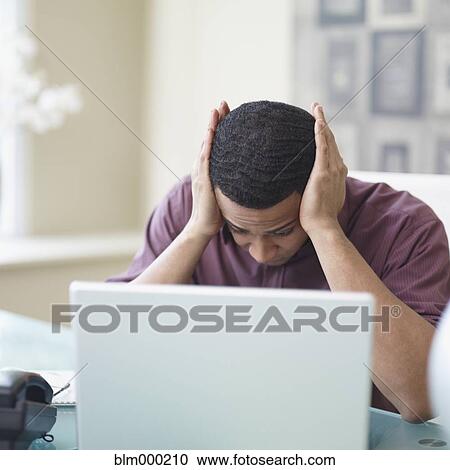 Frustrated African businessman in office View Large Photo Image Stock Image - Frustrated African businessman in office. Fotosearch