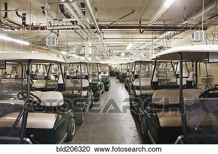 Golf carts in storage View Large Photo Image Stock Image - Golf carts in storage. Fotosearch
