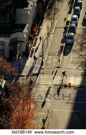 High angle view of bicyclist in city intersection View Large Photo Image Stock Photograph - High angle view of bicyclist in city intersection. Fotosearch