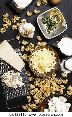 Stock Photograph - High angle view of cheese and pasta ingredients. Fotosearch