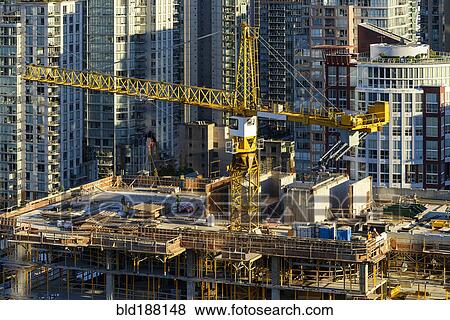 Stock Photo - High angle view of crane building highrise building. Fotosearch