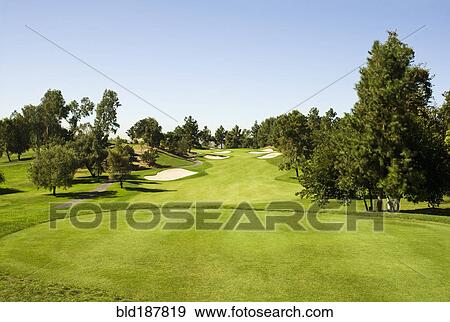 High angle view of golf course under blue sky View Large Photo Image Stock Photo - High angle view of golf course under blue sky. Fotosearch