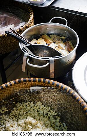 Stock Photo - High angle view of pots of soup and rice. Fotosearch