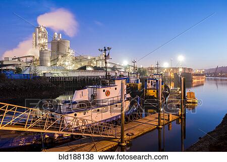 Stock Photo - High angle view of tugboat docked in harbor. Fotosearch